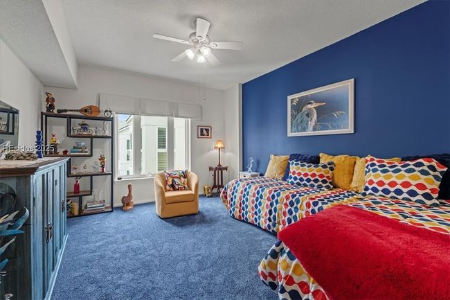 The secondary bedroom is generous in size so that you can accommodate guests and even use it as a den! | Image 22
