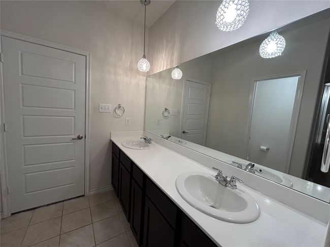 Bathroom featuring tile patterned flooring and double vanity | Image 17