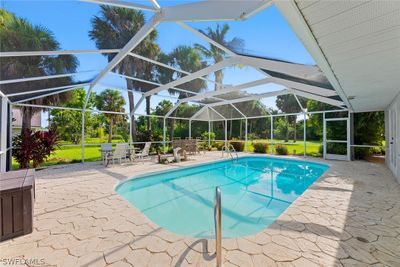 View of pool with a patio and a lanai | Image 1