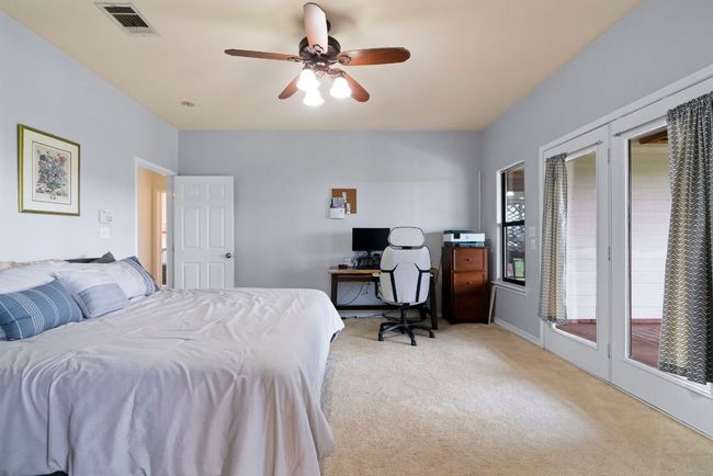 A primary suite that delivers—huge space, natural light, and private access to your covered patio. | Image 20