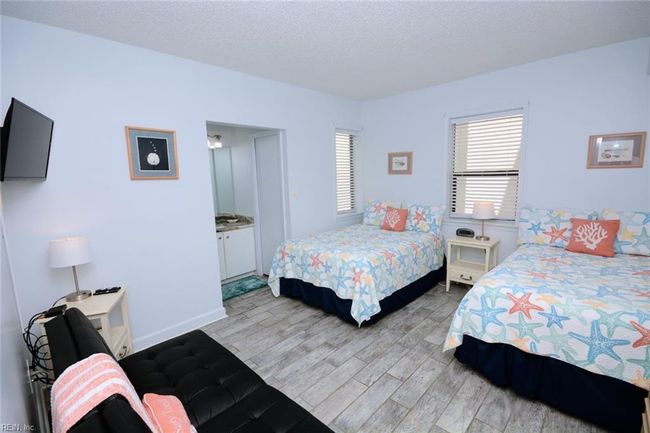 Bedroom with two double beds and full bath | Image 16