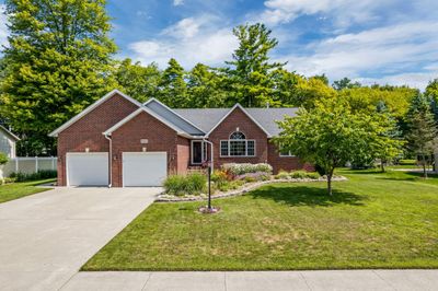 Welcome to this extensively updated, incredibly cared for 5 bed/3 bath home with lake views | Image 1