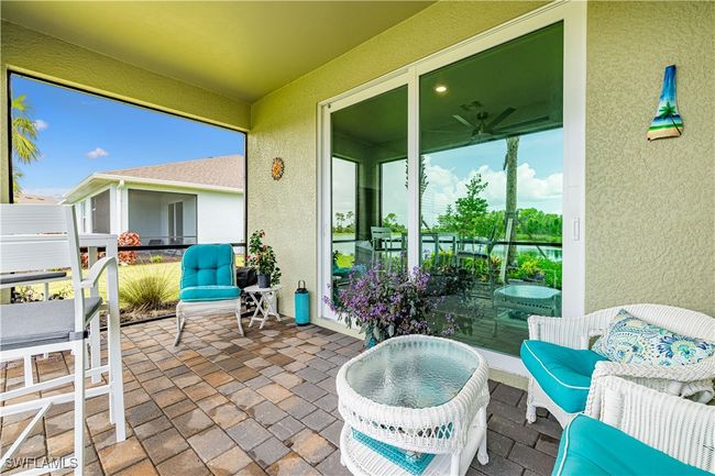 Sunroom / solarium featuring ceiling fan | Image 25