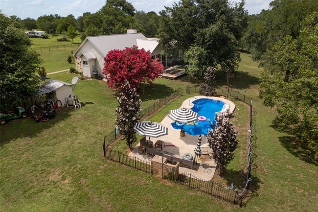 View from above of property with a pool area | Image 28