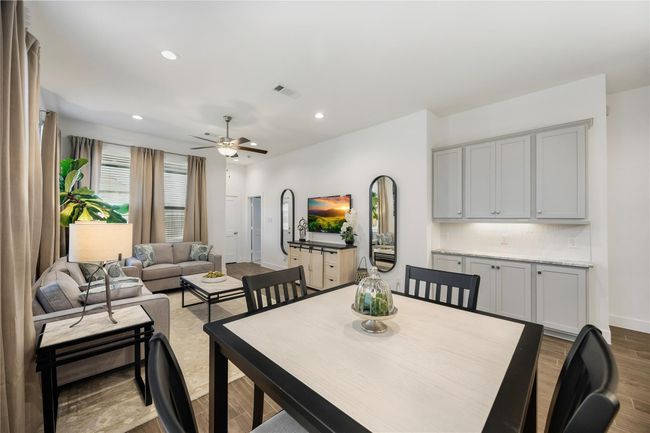 Enjoy an open flow that ties together the dining, kitchen, and living spaces, where abundant natural light and timeless finishes make every gathering feel special. | Image 13