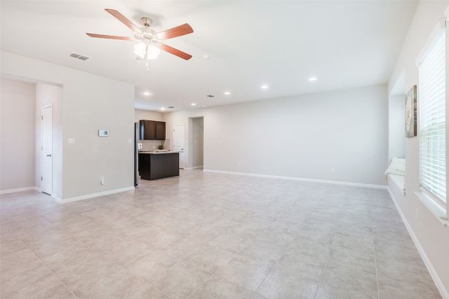 Unfurnished living room featuring visible vents, recessed lighting, and baseboards | Image 10