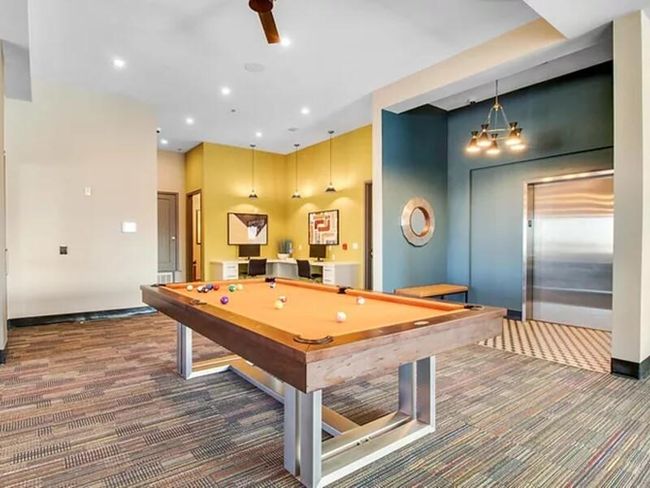 Playroom with carpet floors, recessed lighting, pool table, elevator, and baseboards | Image 11