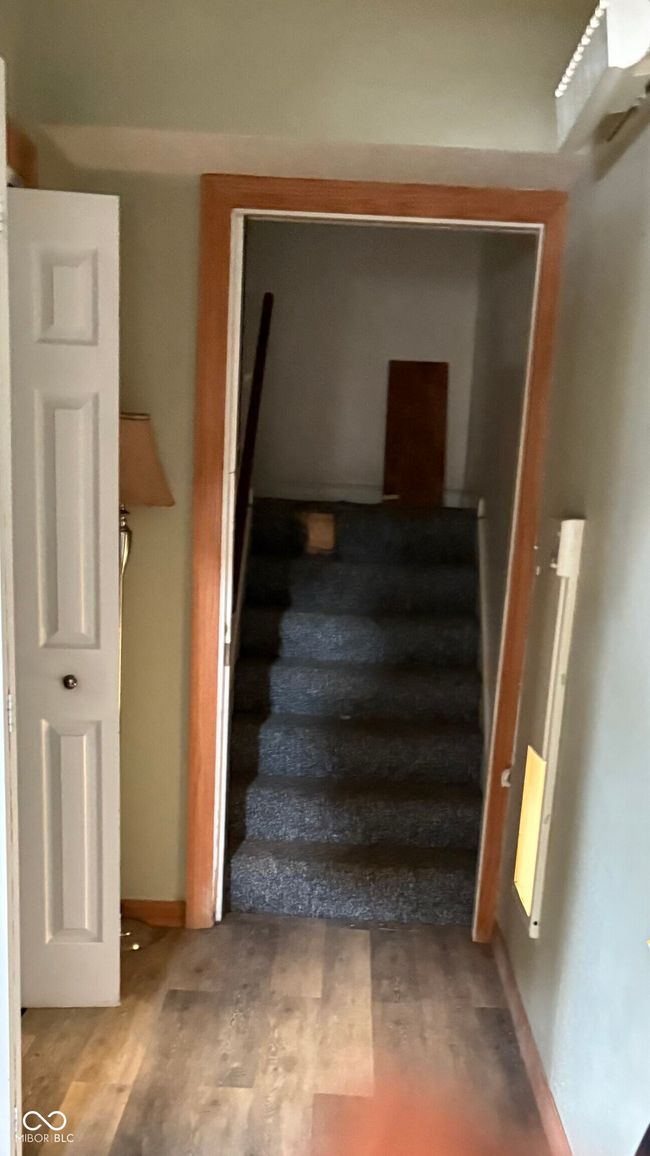 stairway featuring wood finished floors | Image 11
