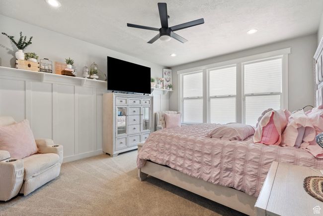Bedroom featuring carpet, recessed lighting, ceiling fan, and a textured ceiling | Image 18