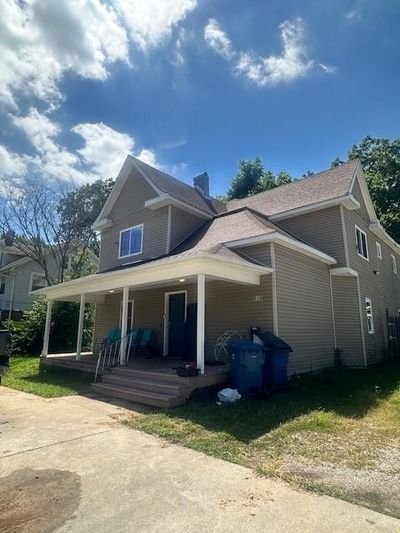 Rear view of property with a porch | Image 1