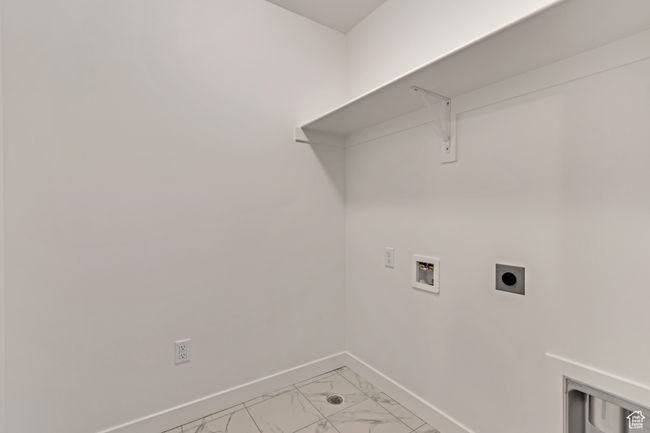 Washroom with baseboards, marble finish floor, washer hookup, laundry area, and electric dryer hookup | Image 12