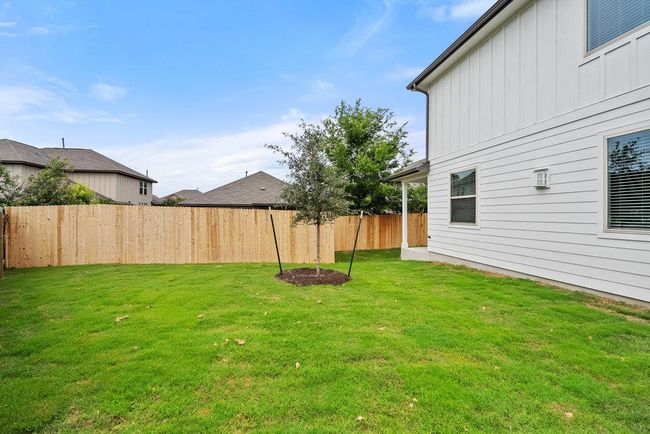 View of fenced backyard | Image 26