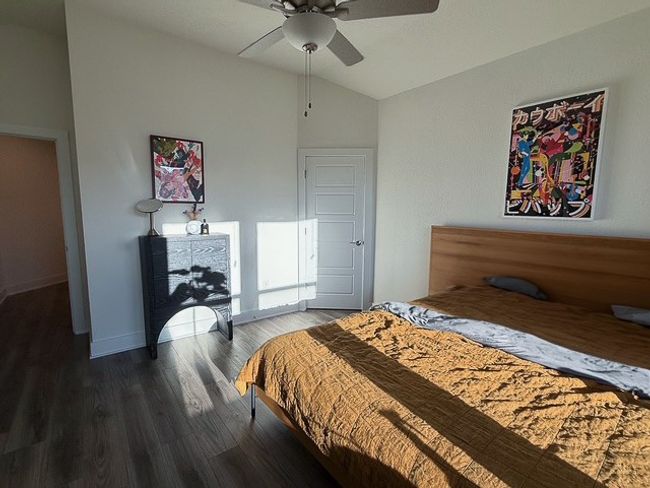 Bedroom with a ceiling fan, baseboards, and wood-look finished floors | Image 14