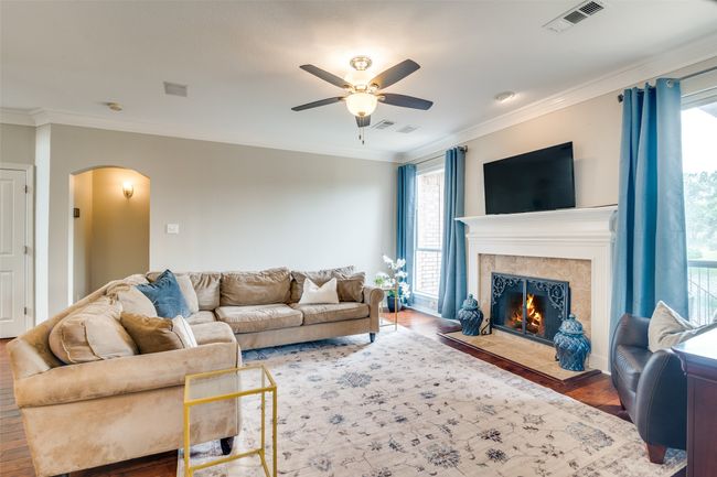 Gather around, discuss your day and enjoy the view of the pond out back. | Image 9