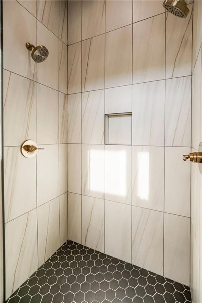 Primary En-Suite shower with tall ceiling and window to the back yard. Photos of previous model home. Not actual listing. Features and sizes may vary. Contact agent for details & showings! | Image 17