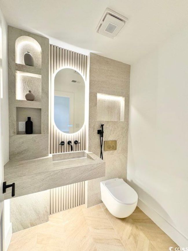 Bathroom with toilet and built in shelves | Image 18