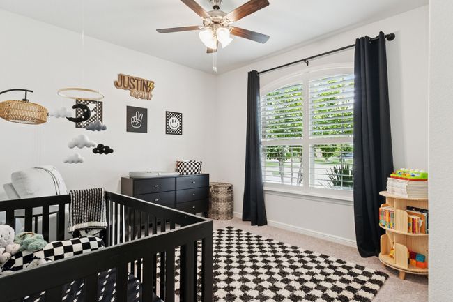 Bedroom featuring carpet and a nursery area | Image 18