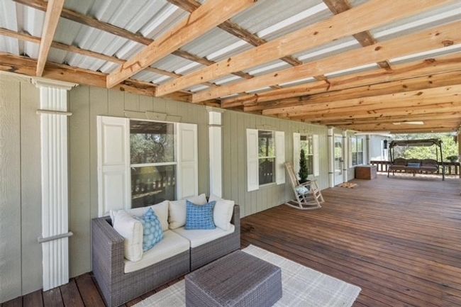 Deck featuring an outdoor hangout area | Image 12