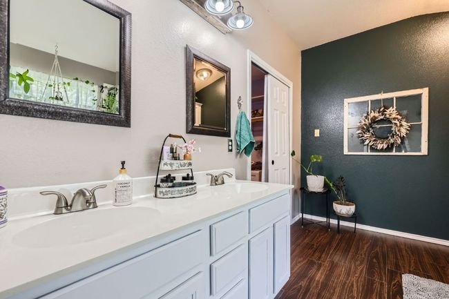 Full bathroom featuring wood finished floors and double vanity | Image 13