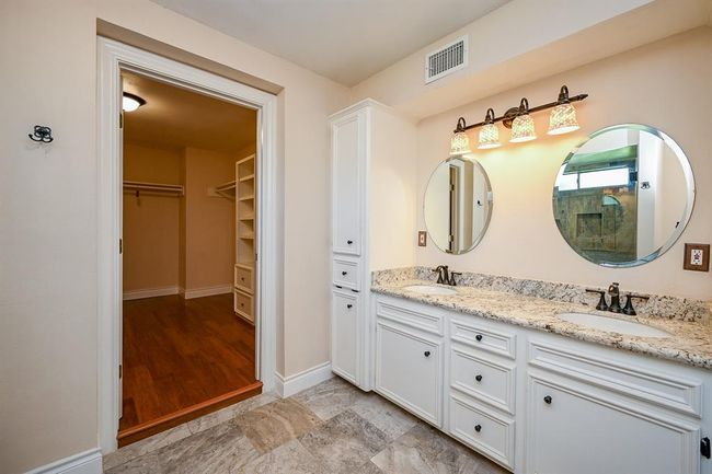 The master bathroom is spacious and allows ease when getting ready in the morning. No bumping elbows!! | Image 20