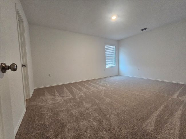 Empty room featuring carpet flooring, baseboards, and visible vents | Image 14