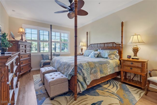 Bedroom featuring ornamental molding, ceiling fan, and wood finished floors | Image 13