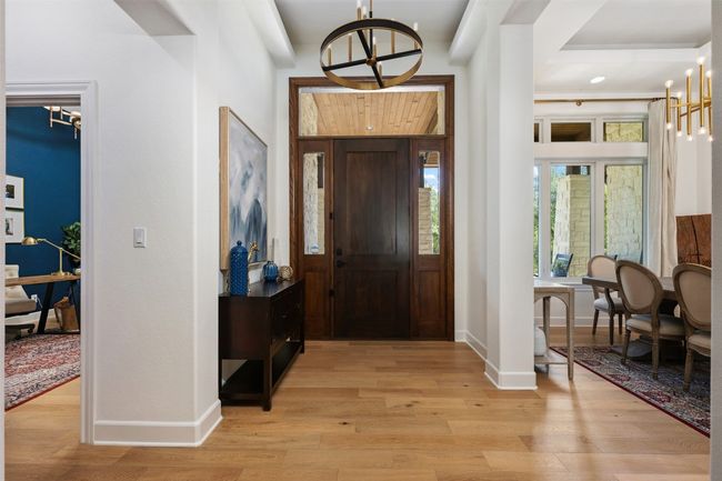 Elegant entry with adjacent office and formal dining. | Image 16