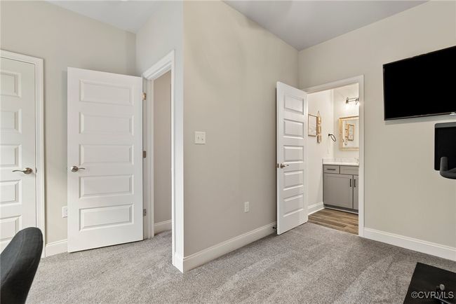 Unfurnished bedroom featuring light carpet and ensuite bath | Image 14
