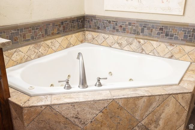 Full bath featuring a whirlpool tub | Image 23