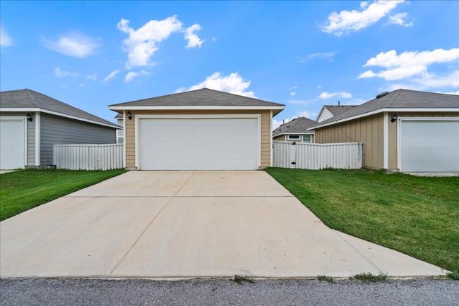 View of detached garage and driveway parking | Image 25