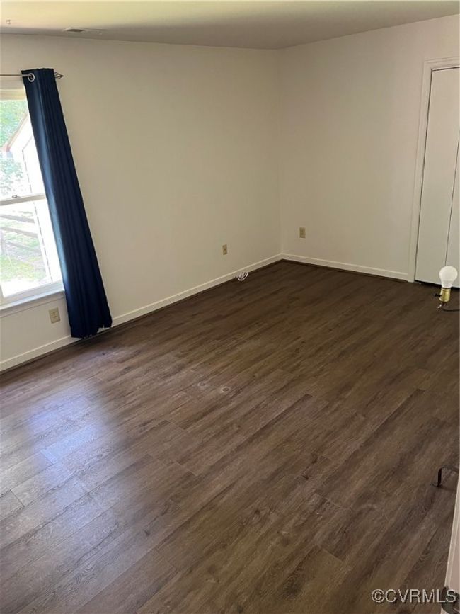 Empty room with dark wood-type flooring | Image 12