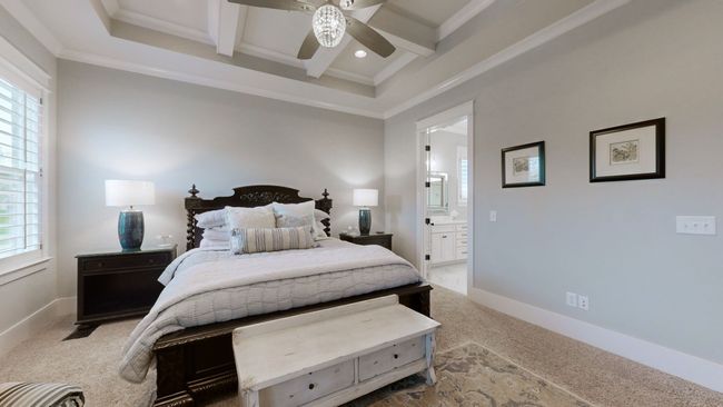 The master suite is a true retreat—featuring elegant coffered ceilings, plush carpeting, and a spa-like en suite just steps away. Sophisticated, serene, and designed for ultimate relaxation. | Image 28