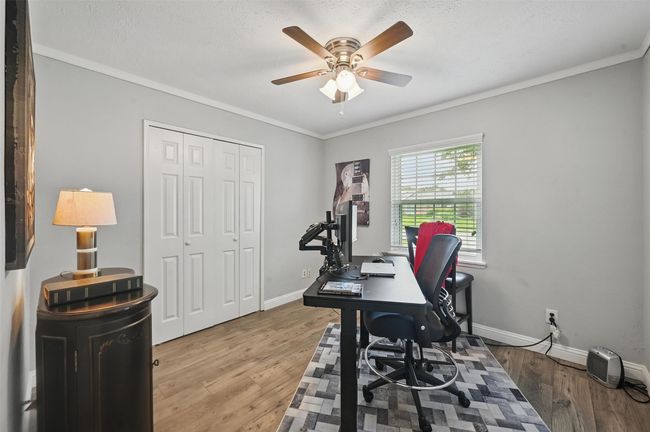Office with a ceiling fan, wood finished floors, and ornamental molding | Image 19