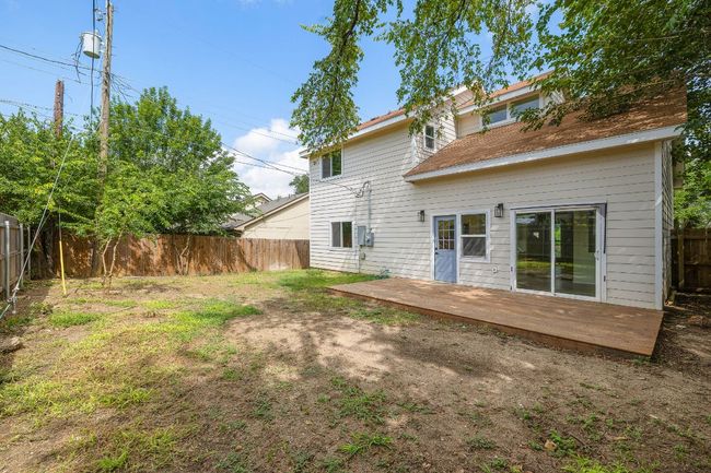 Rear view of house featuring a fenced backyard and a wooden deck | Image 25