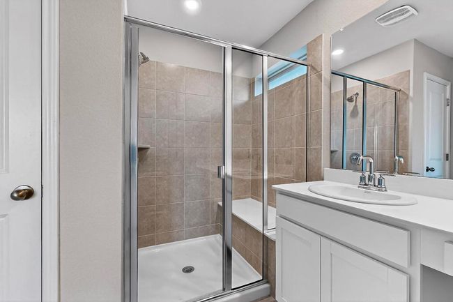 Bathroom featuring vanity and a stall shower | Image 22