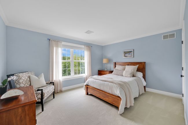 2nd floor bedroom with crown molding and walk-in closet | Image 27
