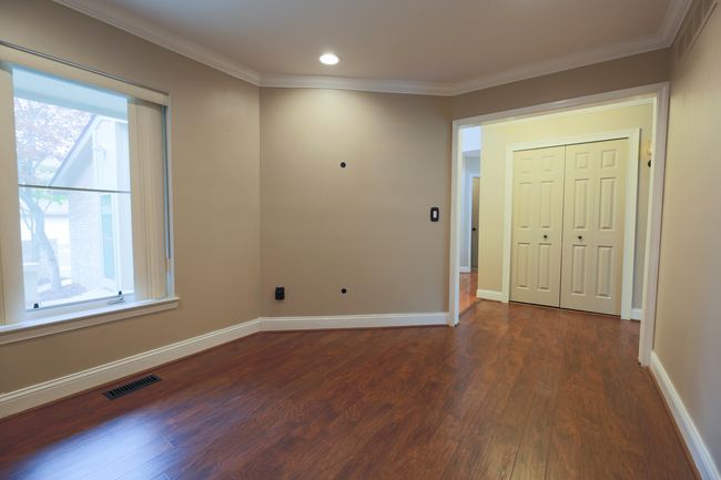 The formal living room can be a home office and is located toward the front door. | Image 10