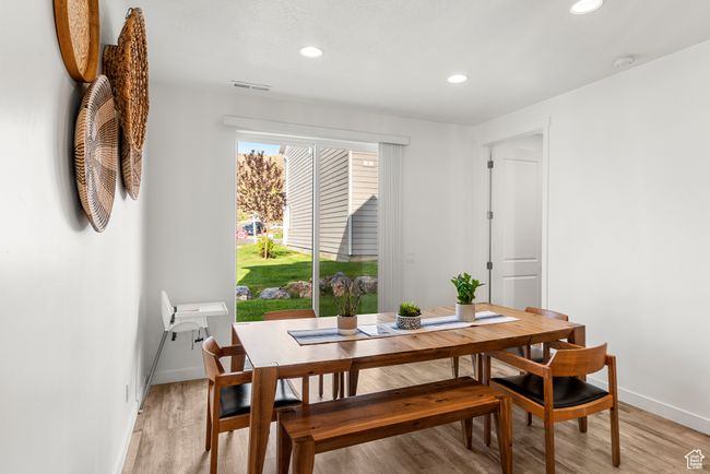 Dining area with recessed lighting, visible vents, light wood-type flooring, and baseboards | Image 10