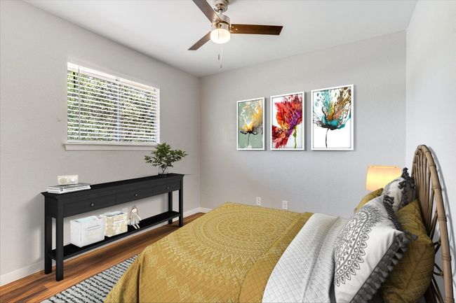 Bedroom featuring wood finished floors, baseboards, and a ceiling fan | Image 7