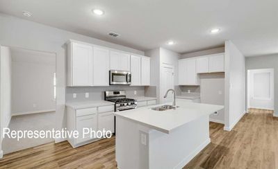 Kitchen with white cabinetry, appliances with stainless steel finishes, and sink | Image 3