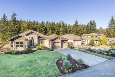 610 Mt. Constance is on a half-acre lot, as are the rest of the homes on this block. Part of the lot extends to the woods in the background. Beyond that is Washington State forest lands. | Image 2