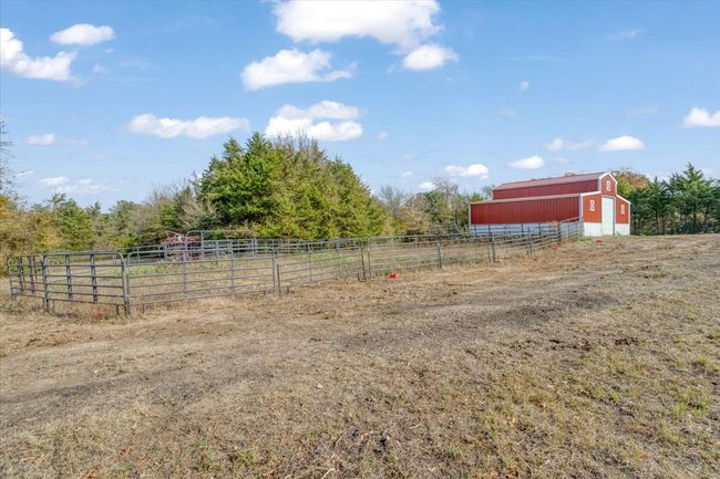 View of yard with a rural view and an outbuilding | Image 10