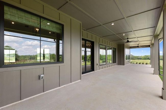 The back patio is spacious to accommodate dining and lounging. There are rough-ins for a gas grill and vent near this window on the left. | Image 40