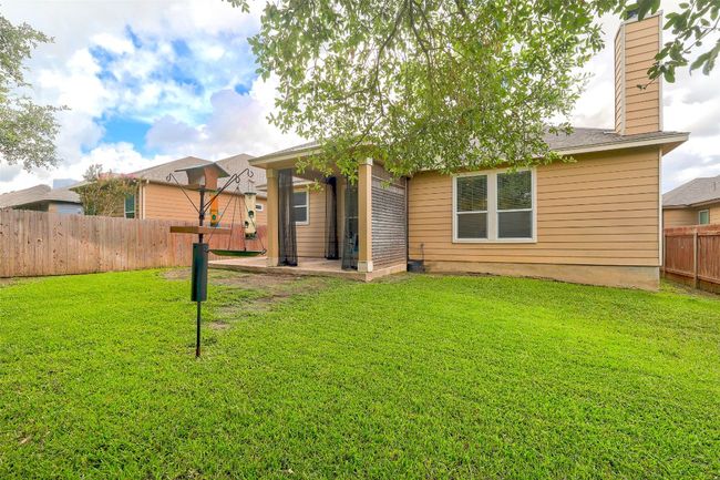 Back of property featuring a fenced backyard | Image 39