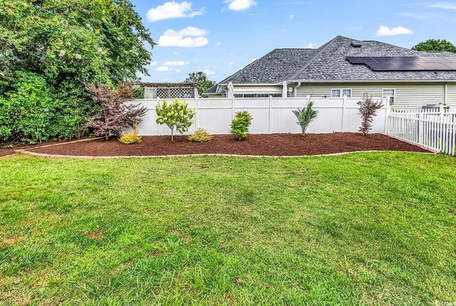 View of fenced backyard | Image 33