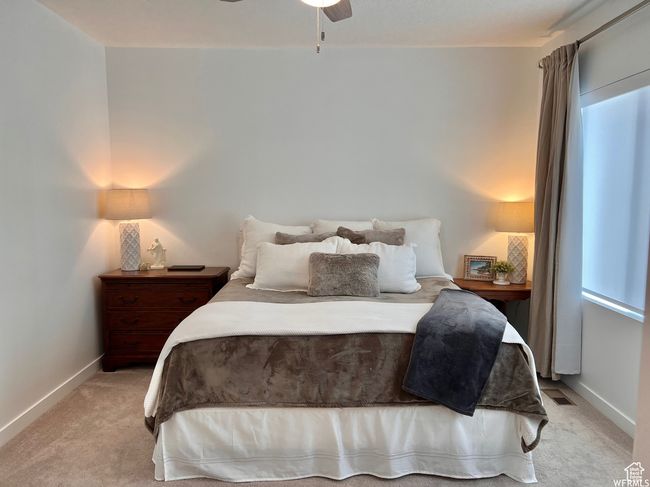 Carpeted bedroom with ceiling fan | Image 7