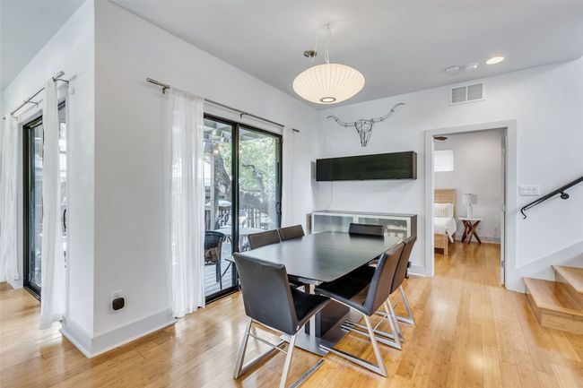 Dining room with light wood-type flooring | Image 13