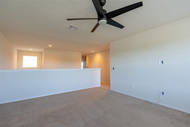 Empty room featuring ceiling fan, recessed lighting, and carpet flooring | Image 11