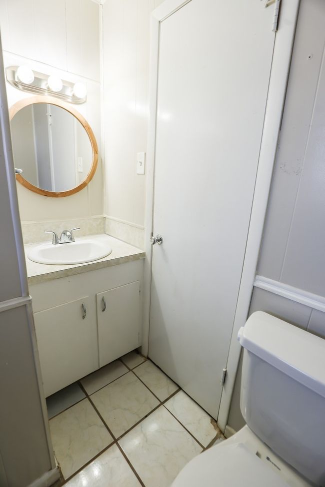 Bathroom with toilet and vanity | Image 18