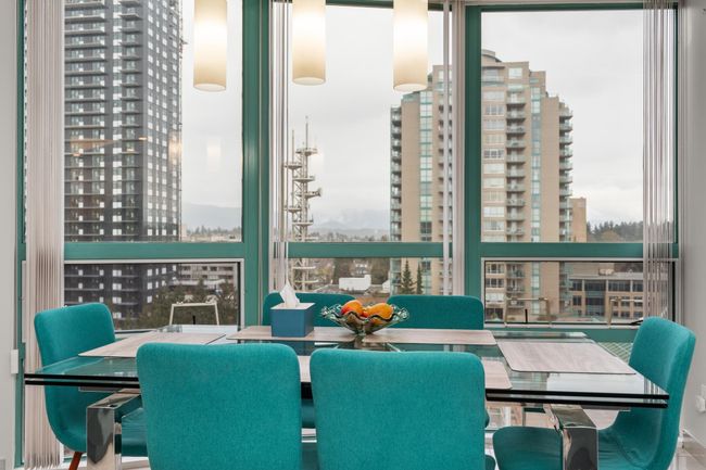 Dining room featuring a city view and expansive windows | Image 20